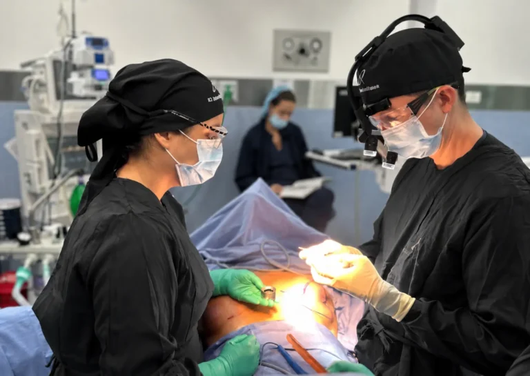 Dr. David Delgado operating with his surgical team in Medellín, Colombia